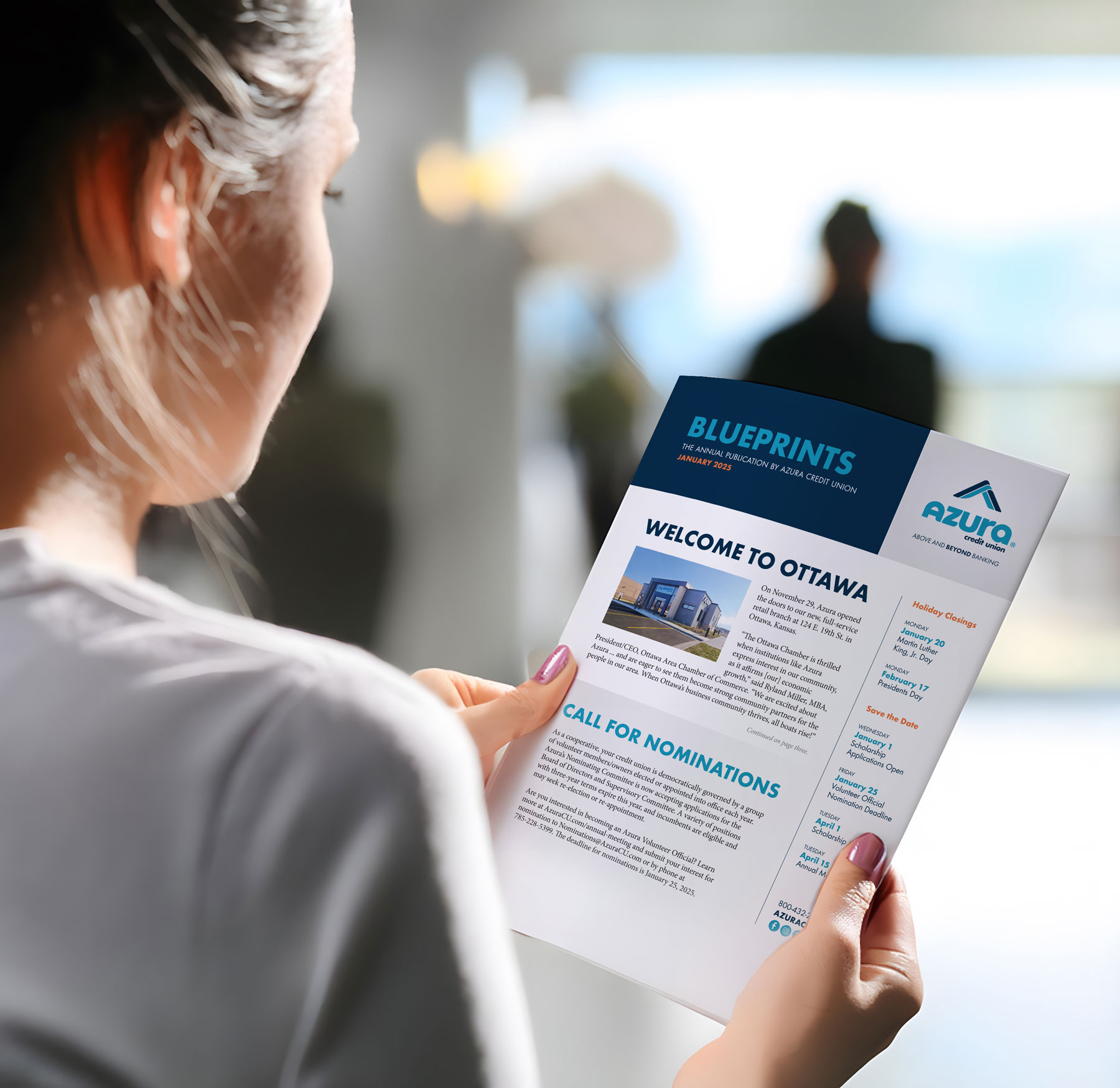 woman reading Azura newsletter